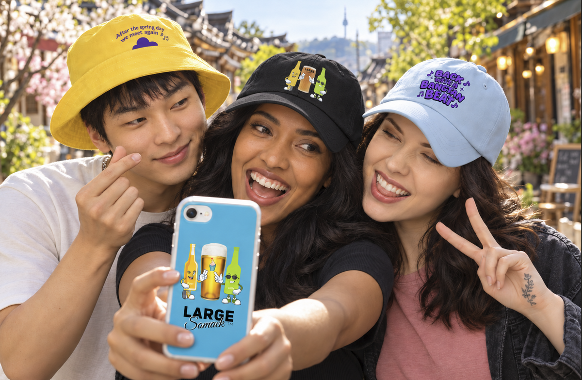 Friends wearing Large Somaek bucket and baseball hats in Seoul